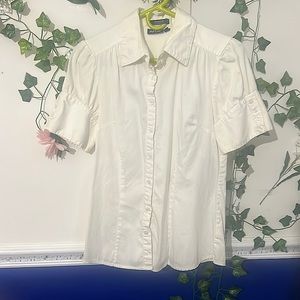 A basic cream color button down shirt